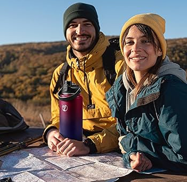 Two people enjoying an outdoor adventure with reusable drinkware, from Ceason's style gallery